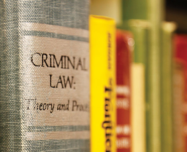 Closeup on well worn book on criminal law theory and practice