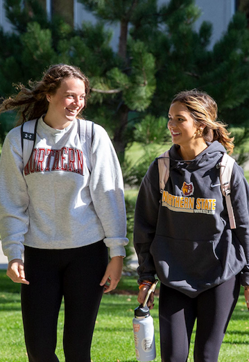 Students walking on campus green