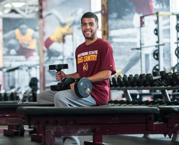  A student in a weight room