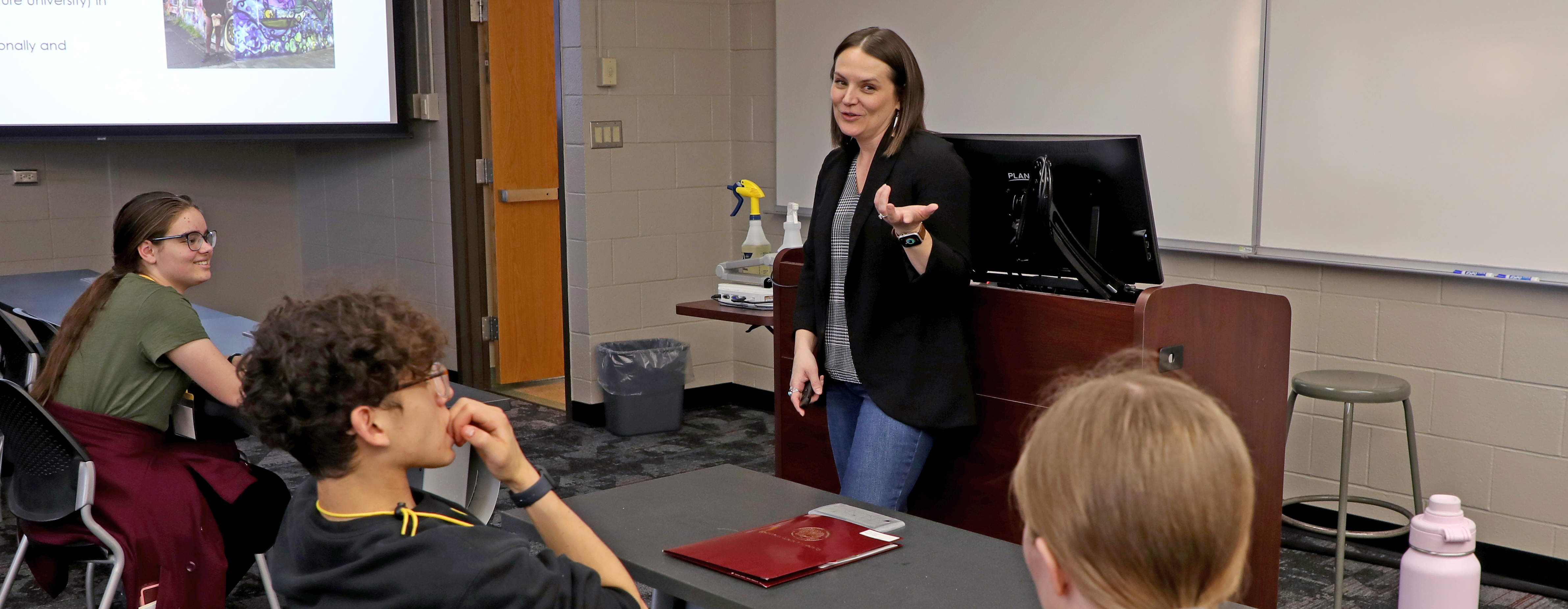 Faculty and students in a classroom setting.