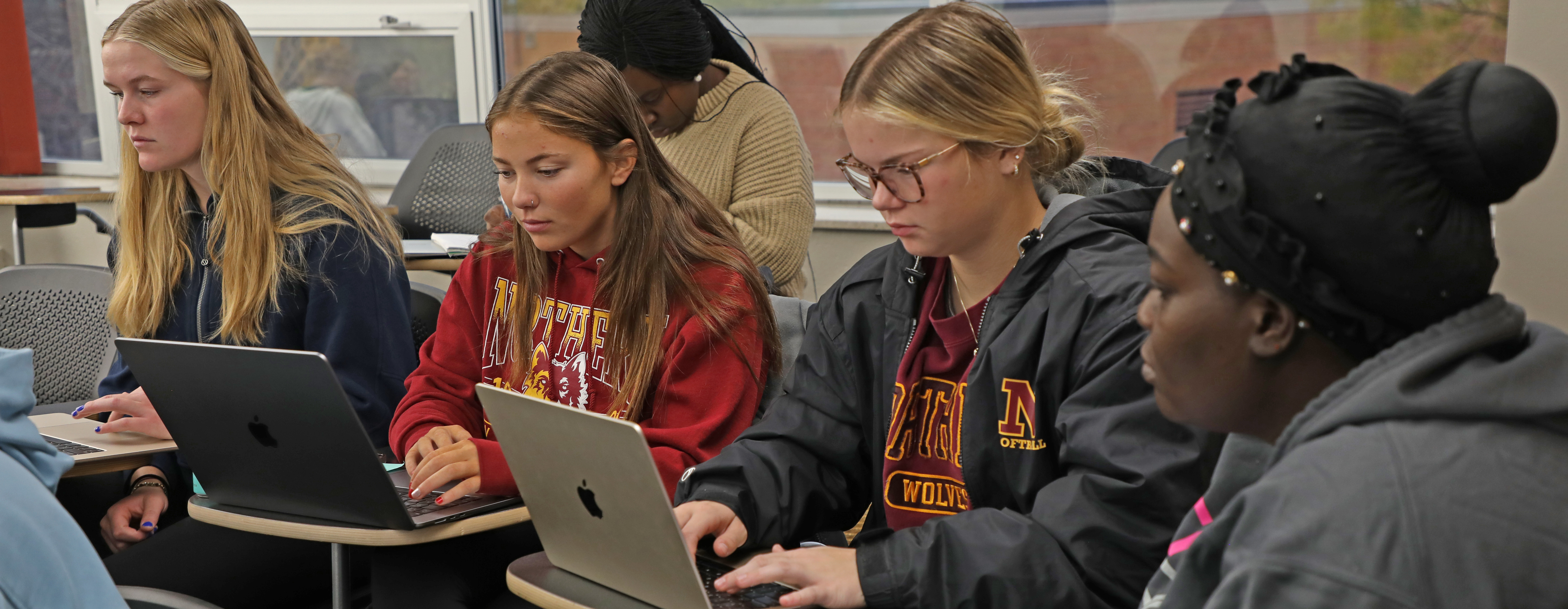 Group of students working on a classroom project.