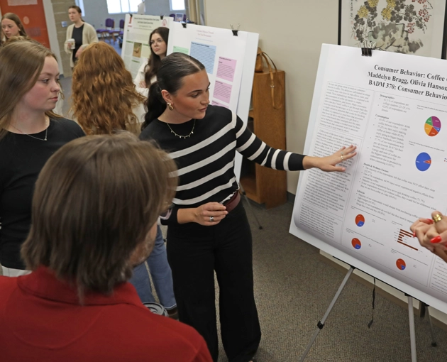 Student presenting research to audience