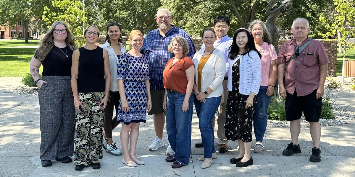 Photo of the department faculty standing outside