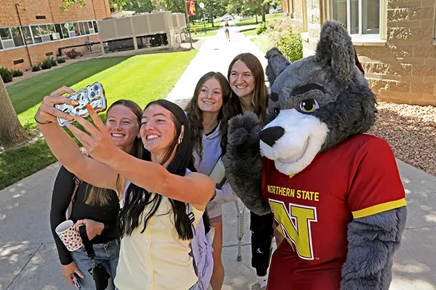 Students posing for a selfie with Thunder the NSU mascot
