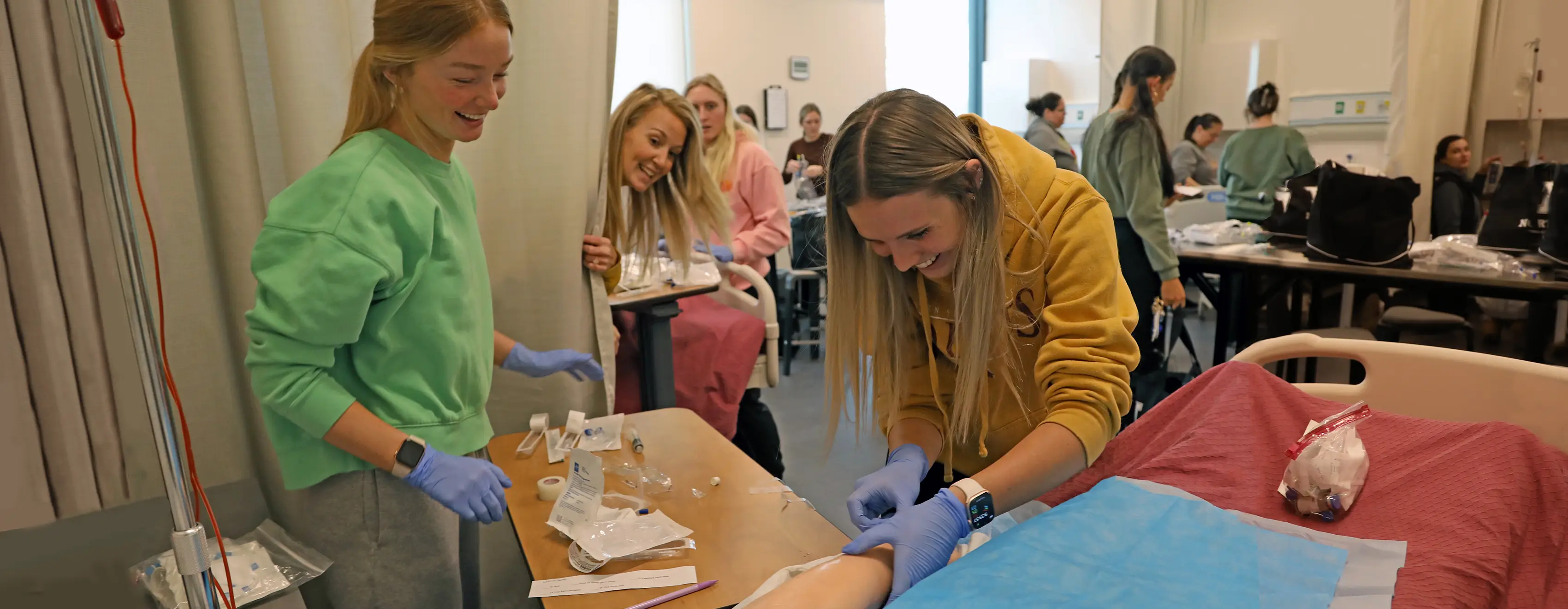 Nursing students working at a Skills Clinic