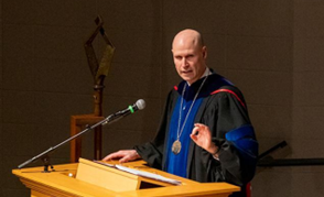 President Schnoor at podium