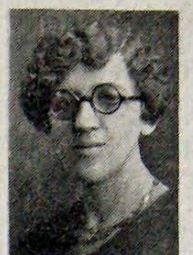 Historical portrait of Emeline Welsh, a woman with wavy hair wearing glasses