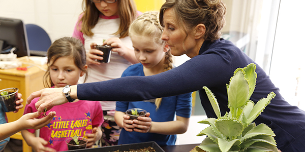 Dr. Alyssa Kiesow helps in a classroom