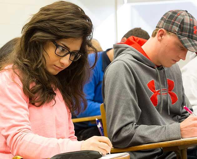 Two students work in class