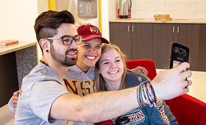 Three students take a selfie