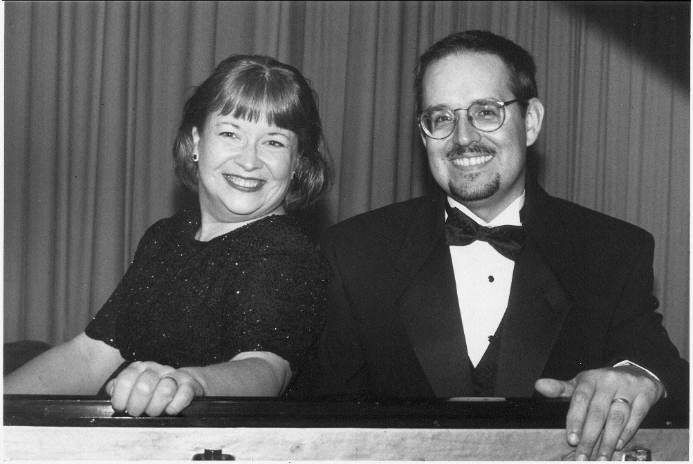 Portrait of female and male piano performers
