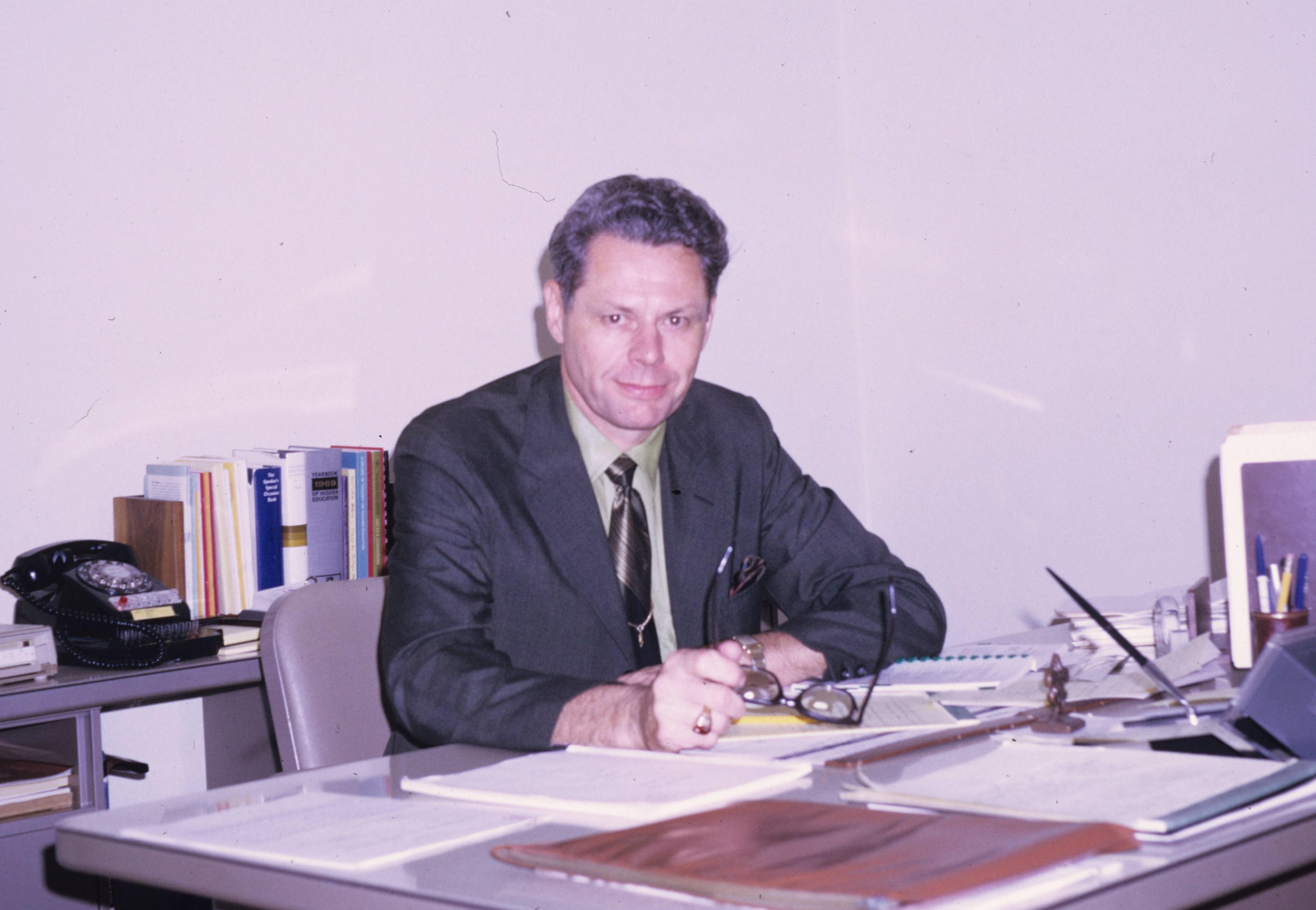 Lester Clarke sitting at his desk