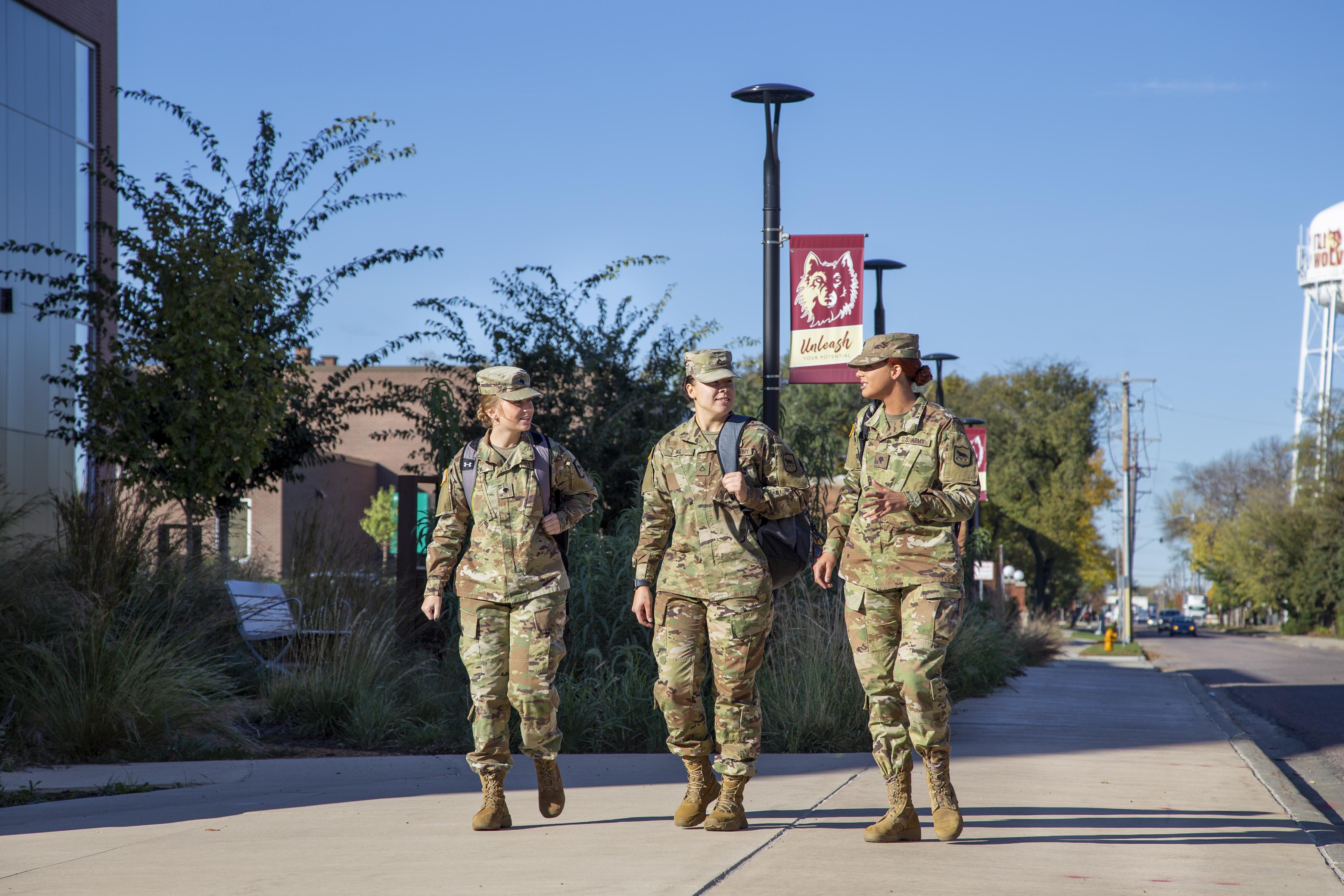 Three soldiers walking on the NSU campus