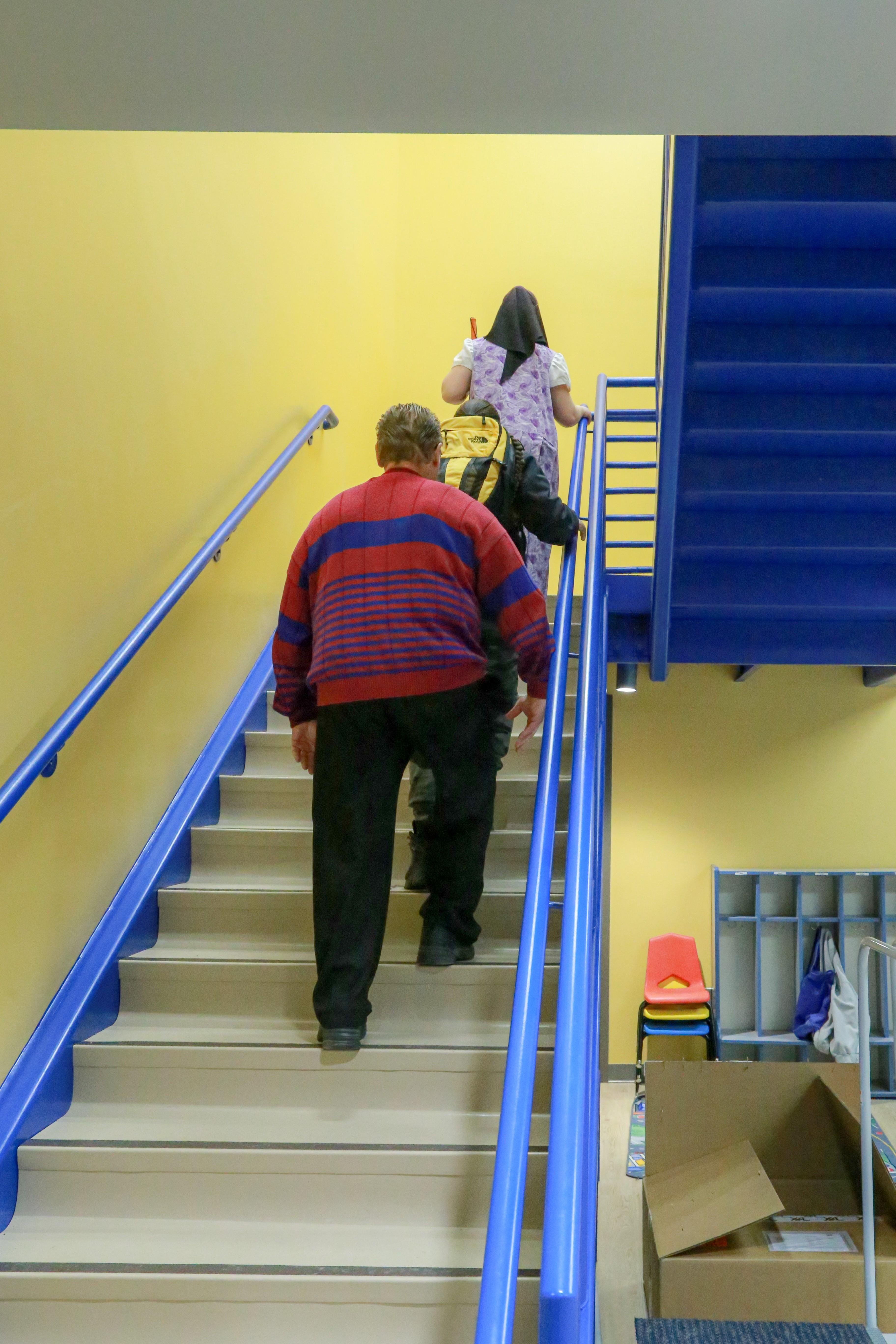 Students at SDSBVI walking up staircase
