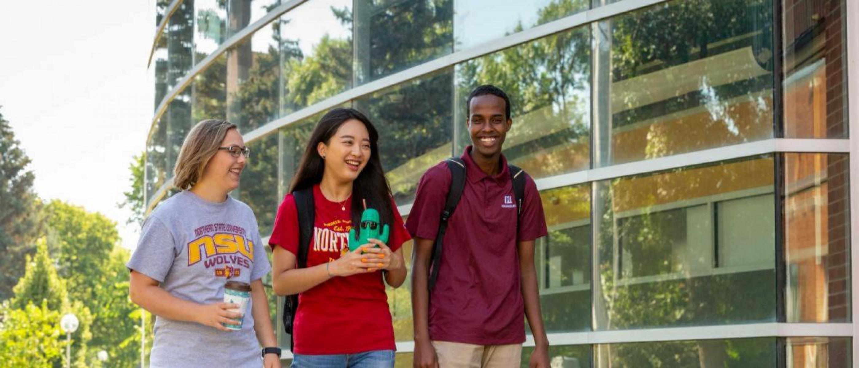 Students walk in front of the Technology Center