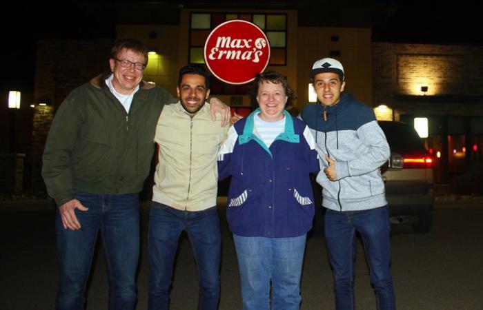 Family and Friendship Family Program smiling arm in arm in front of the late local Max & Erma's restaurant