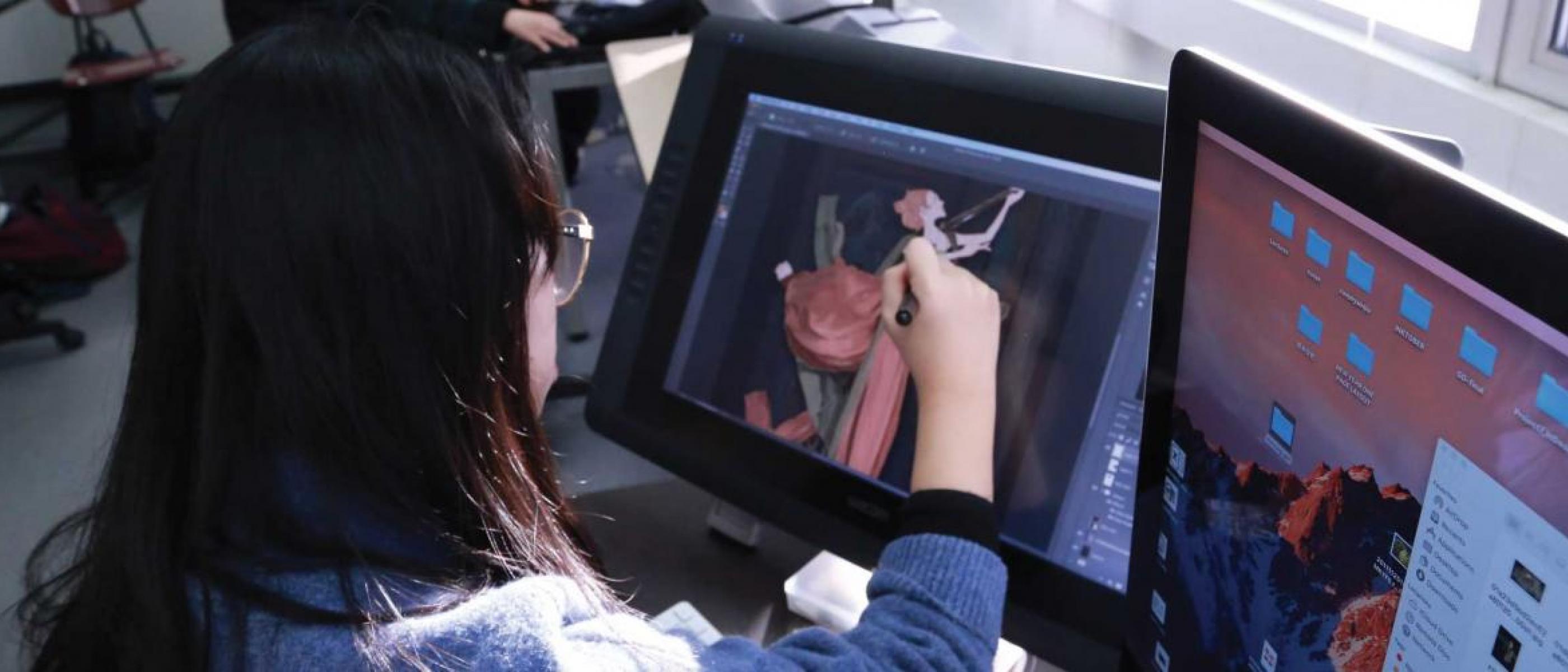 Student using graphic design studio