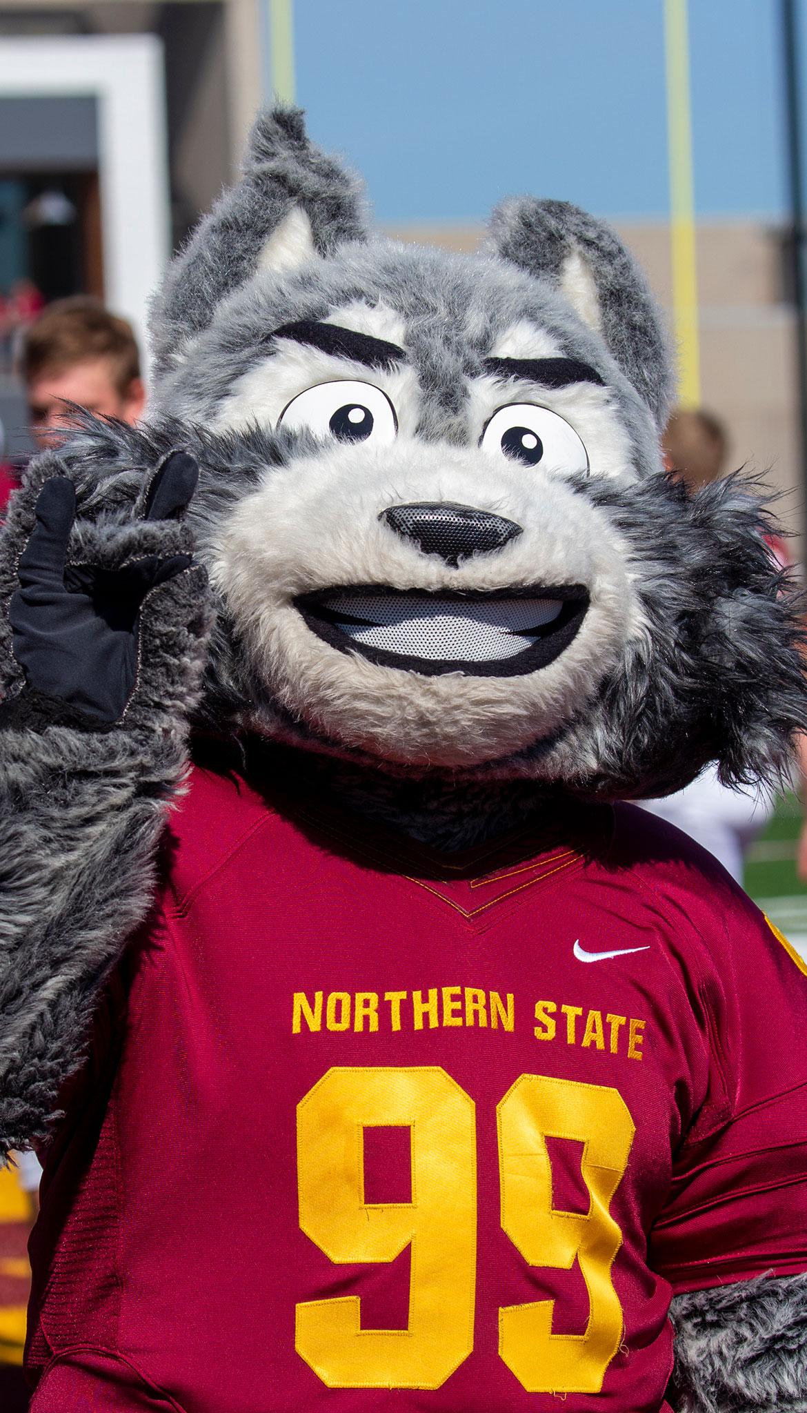 Northern State University's Thunder the Wolf waves