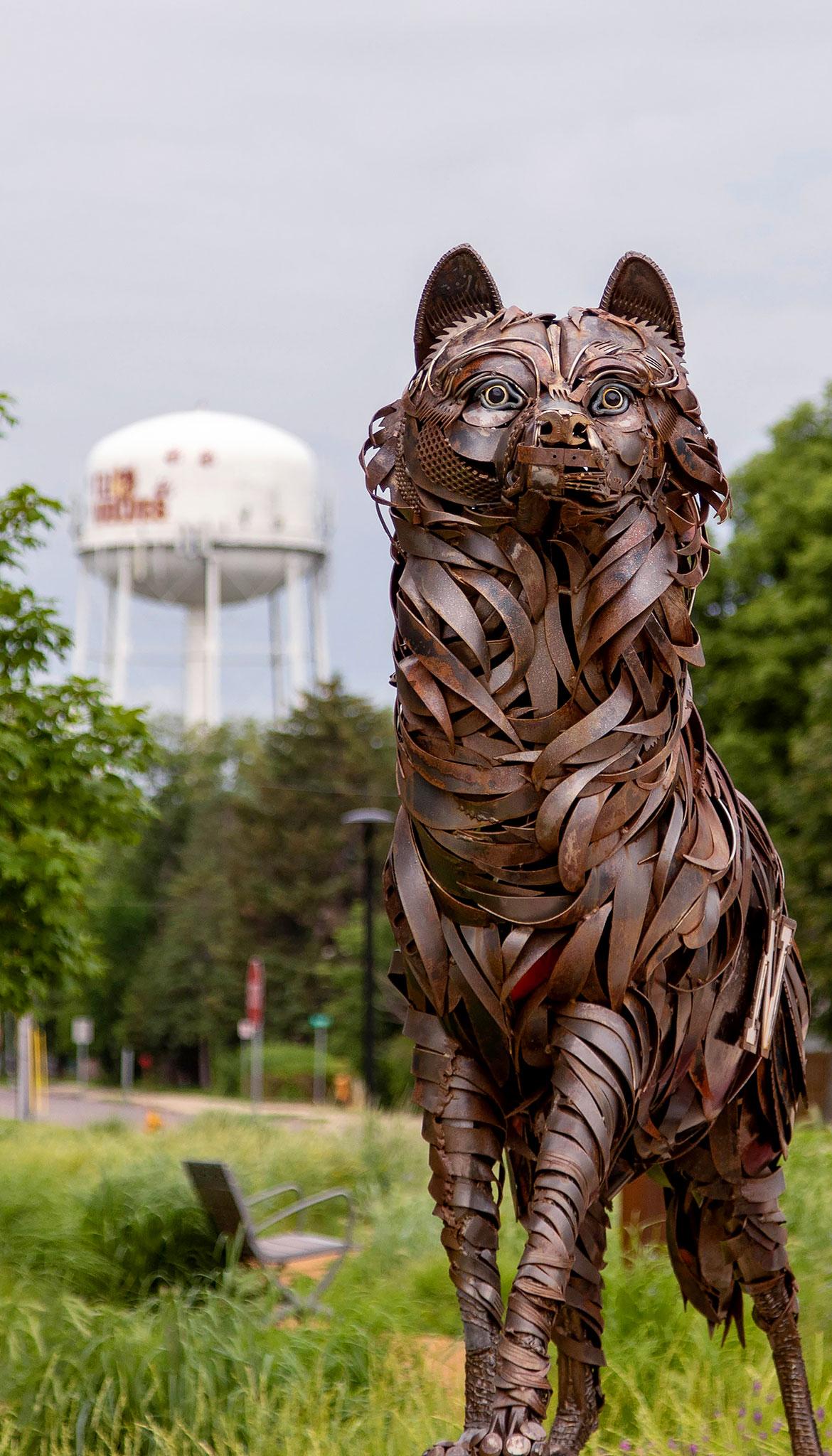 Northern State University metal wolf sculpture in front of the NSU water tower