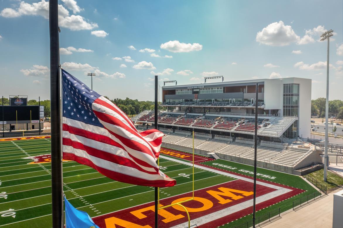 American flag flies in front of Dacotah Bank Stadium