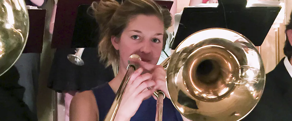 a festival participant plays trombone