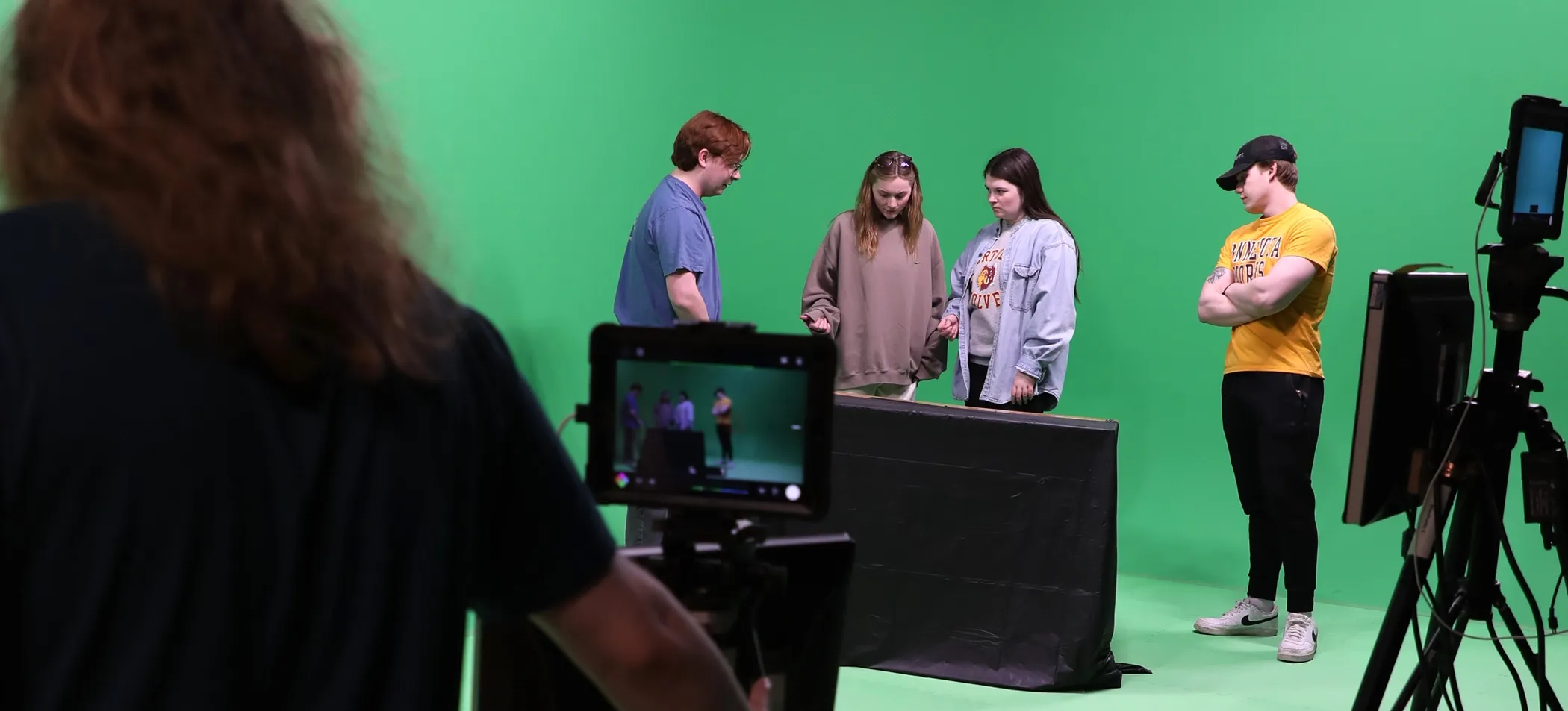 Students work in a digital media setting