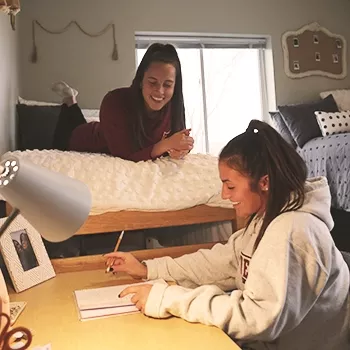 students hang out in a dorm room
