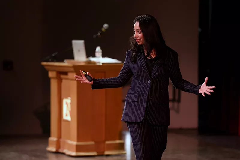 Radhika Dirks addresses the audience at a presentation at NSU