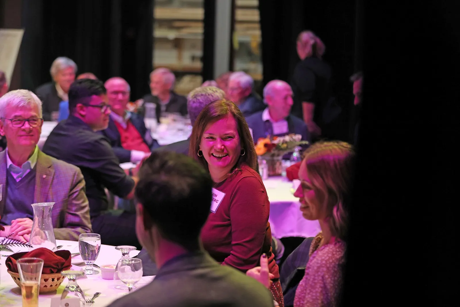 People sitting at tables during a dinner party