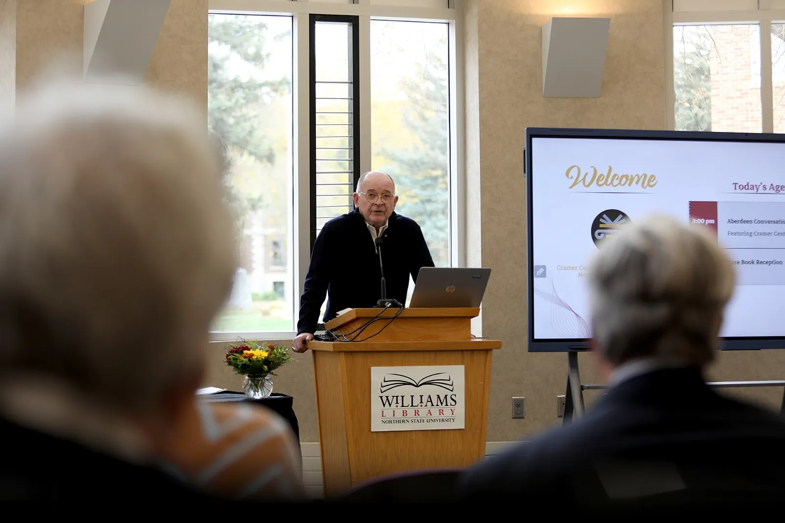 Person standing at a podium giving a speech