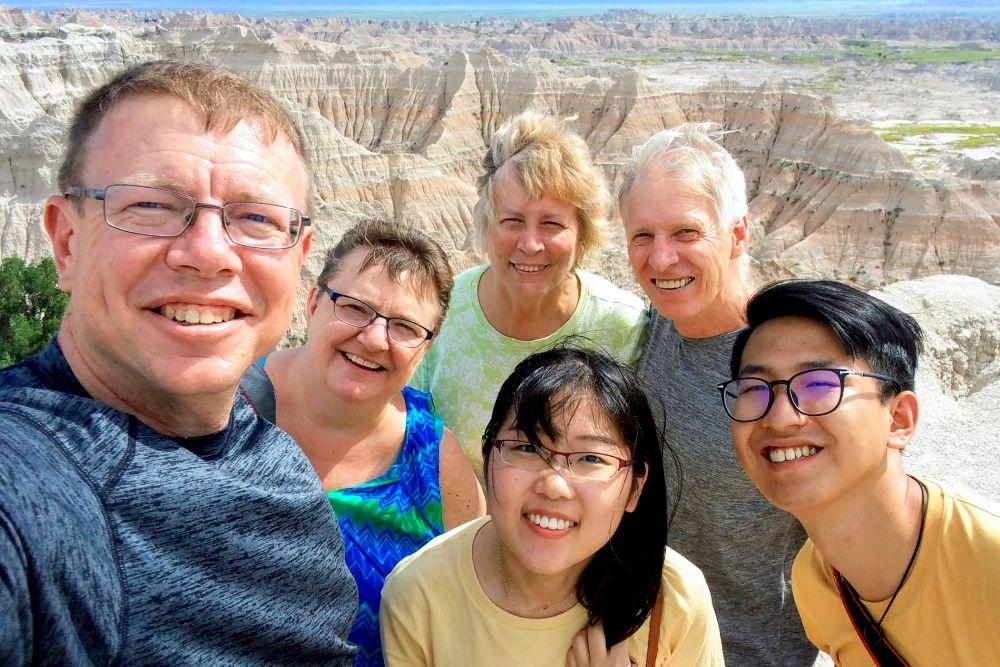 Students and friendship family on hiking trail