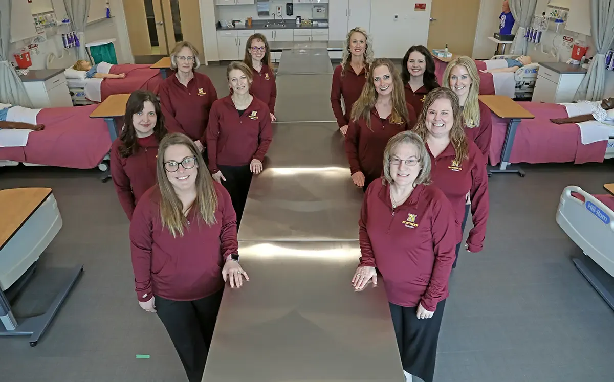 Nursing staff standing in the middle of the Simulation Lab