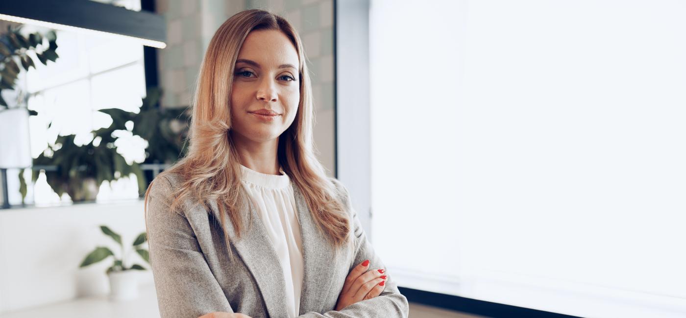 Portrait young businesswoman formal outfit standing near window office