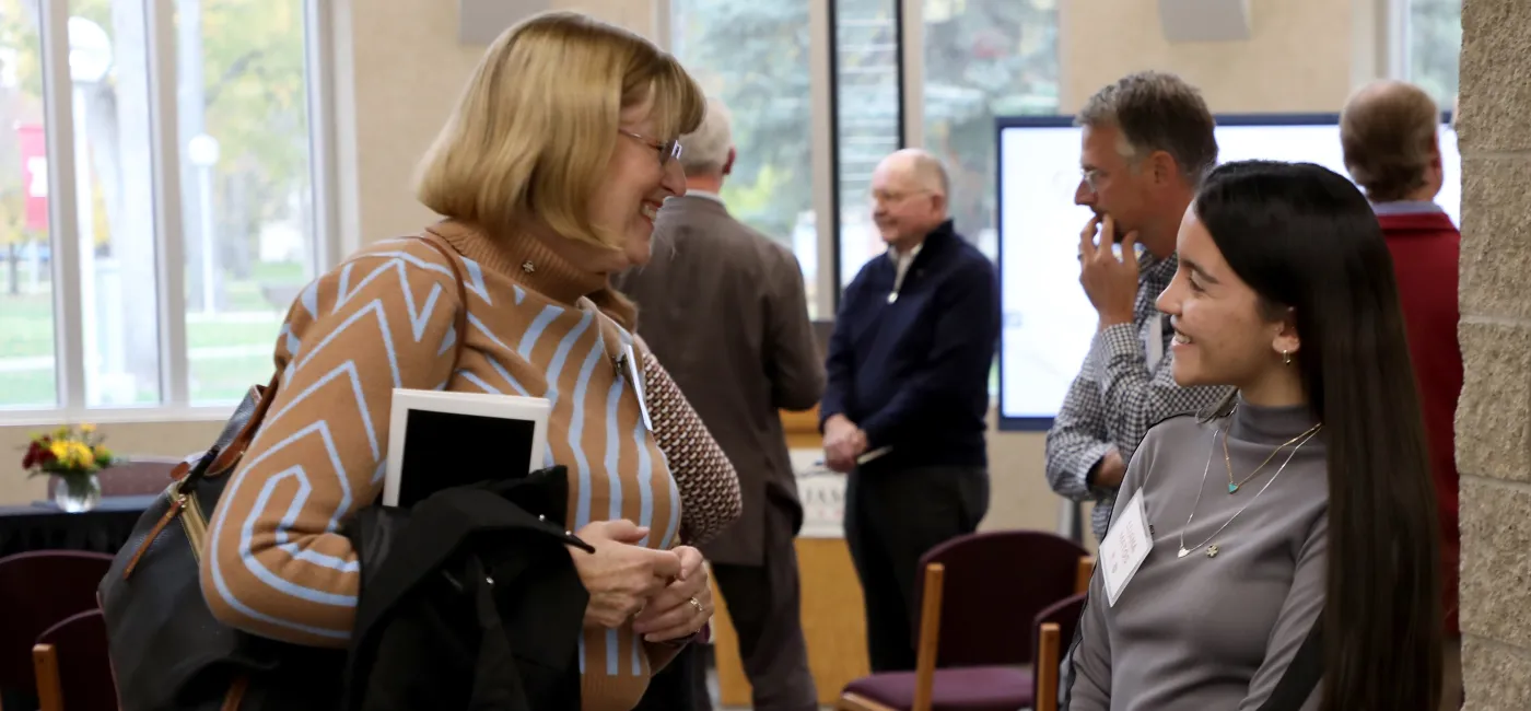 Student talking to an adult