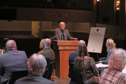 Speaker at a podium in front of a group of people
