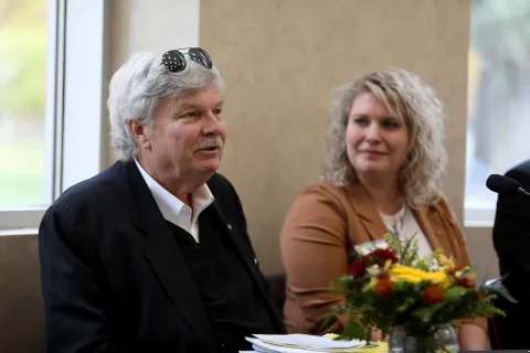 Person speaking to another person who is listening