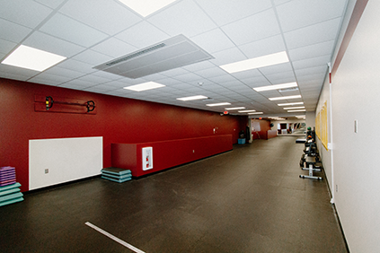 Southeast view of the fitness studio. The image shows the entire length of the fitness studio from north to south and features a pull-up bar.