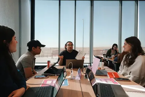 Students sitting at a conference table