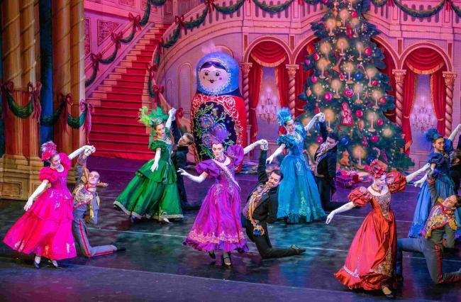 Nutcracker dancers performing on stage in colorful costumes