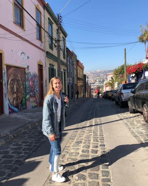 Student standing outside in a city in Chile