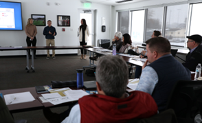 NSU students presenting a marketing plan to members of the AACF Board