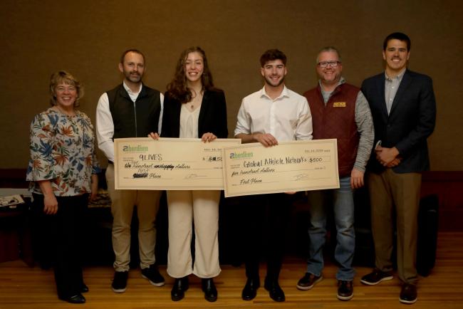 Alexandria Arndt, center left, and Sam Tremelling, center right, were presented with $500 checks for their winning ideas at Northern’s Idea Pitch Competition. The judges were, from left: Kelly Weaver, Small Business Development Center; Tim Hanigan, Banner Engineering; Mike Bockorny, Aberdeen Development Corp.; and Olaf Hansen, Dacotah Bank.
