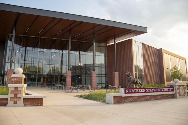 On the north east corner of campus the wolf statue is in front of the science building