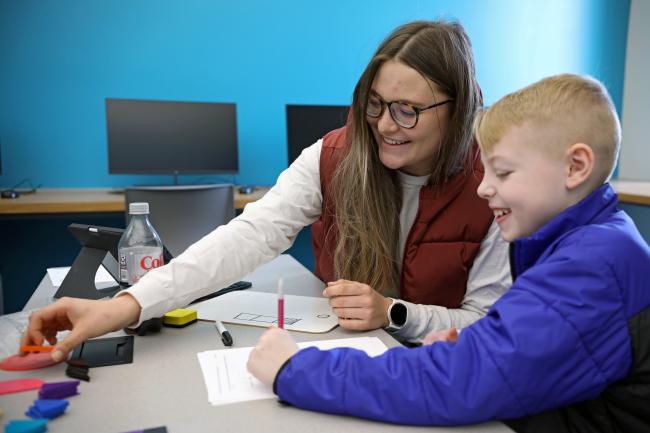 Northern State student Kenna Webb works with Haydyn Opitz at a math clinic on Feb. 27 in the Jewett Regional Science Education Center