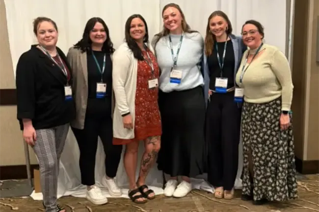 Six graduate students from Northern State University's counseling programs posing for a photo