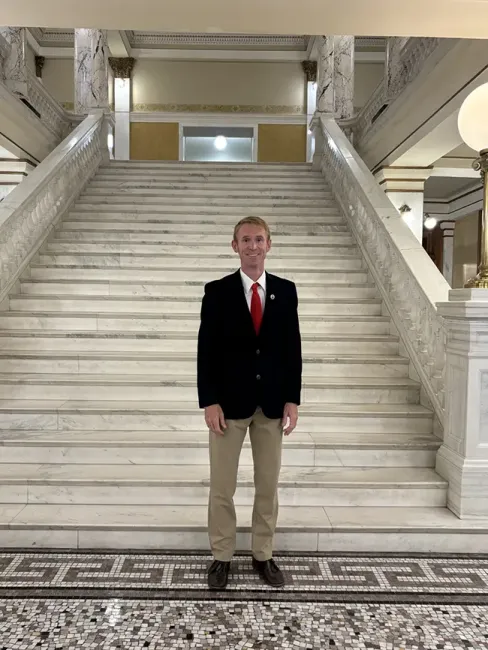 Ryan Decker, history teacher at Tea Area High School, Rising Scholars instructor and 2026 Board of Education Standards William Beadle History Teacher of the Year, stands in the South Dakota State Capitol during the Sharing the Spirit of America event. Photo courtesy of Ryan Decker