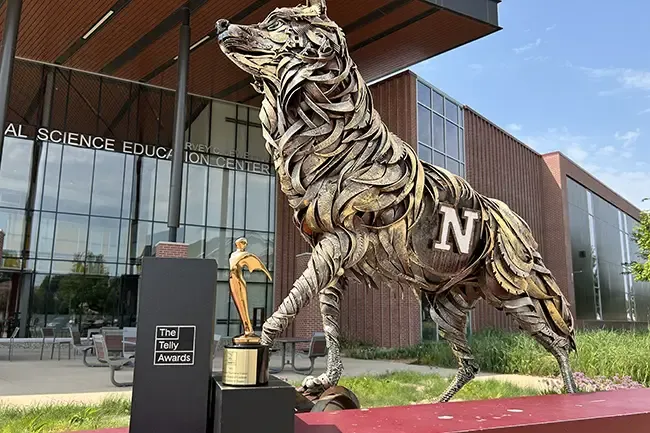 A Telly Award sits before the Wolf Statue at Northern State University.