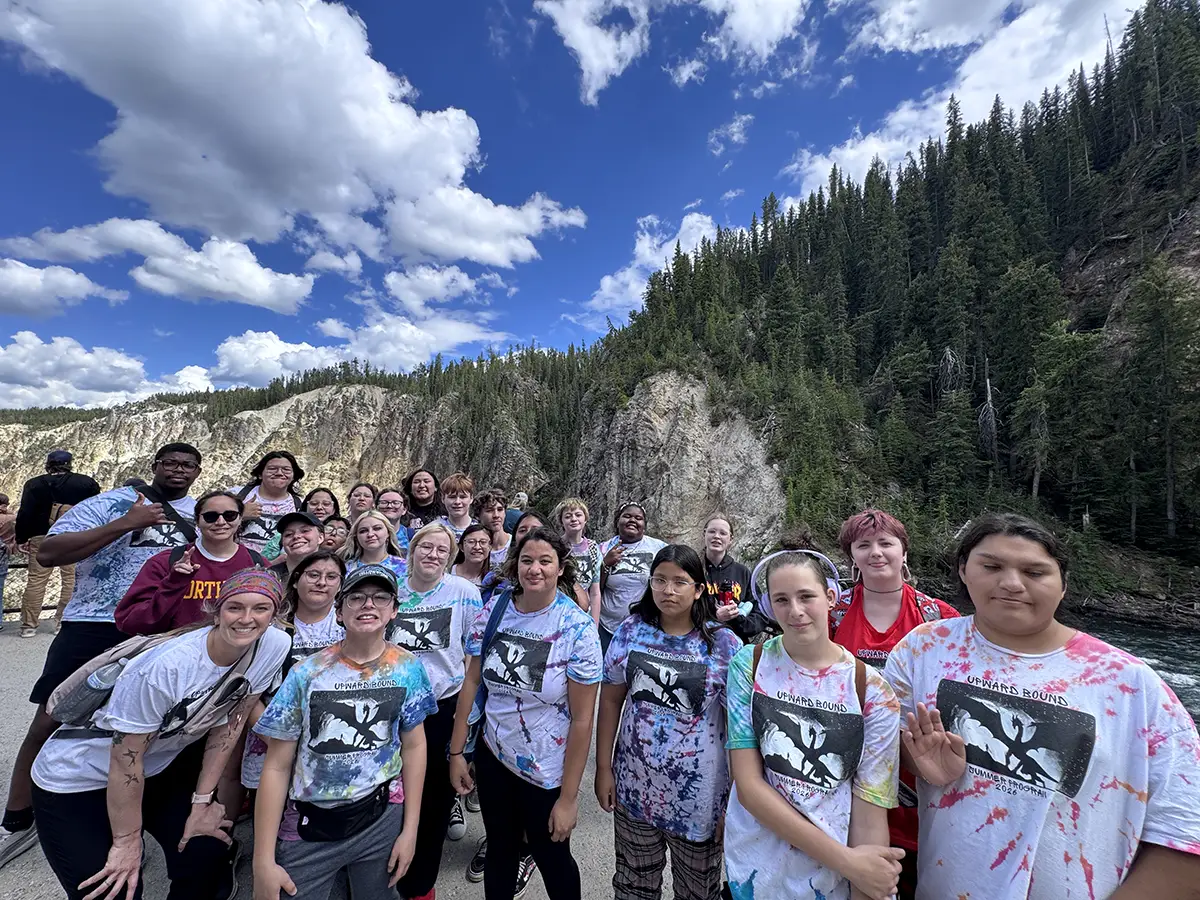 Group photo of participants in the 2026 Upward Bound Summer Program during a visit to Yellowstone National Park as part of a college tour trip to Billings, Montana.